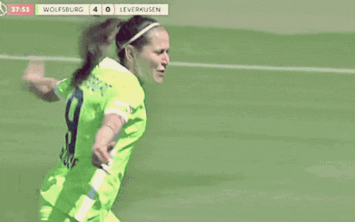 a soccer player celebrates a goal during a game against leverkusen