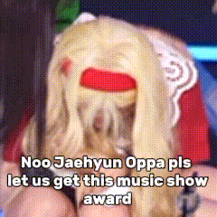 a woman with blonde hair and a red band around her head says noo jaehyun oppa pls let us get this music show