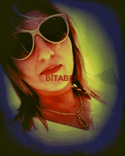 a woman wearing sunglasses with the word bitaben written on her face