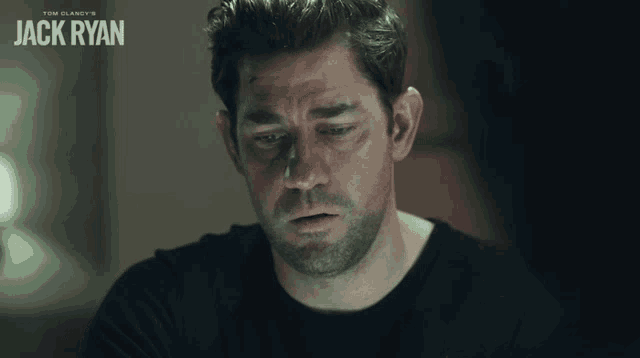 a movie poster for tom clancy 's jack ryan features a man looking down