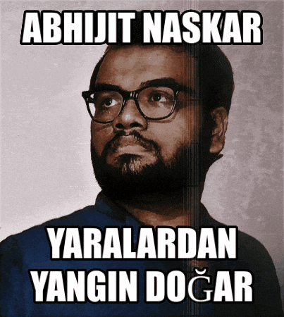 a man with glasses and a beard has the name abhijit naskar on the top of his head
