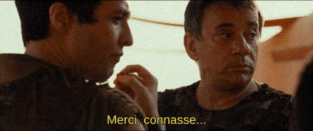 two men are talking and one of them says merci commasse
