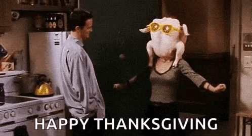 a man and a woman are dancing in a kitchen with a turkey head .