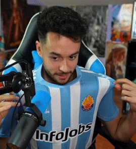 a man wearing a blue and white striped shirt that says infojobs on it