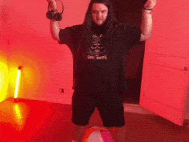 a man with long hair wearing a shirt that says candy bunter