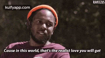 a man wearing an orange hat and a purple shirt is saying cause in this world that 's the realist love you will get .