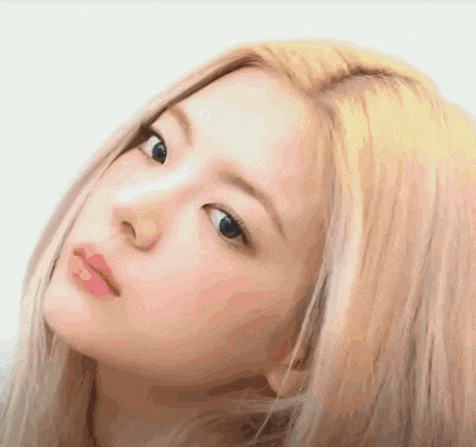 a close up of a woman 's face with blonde hair