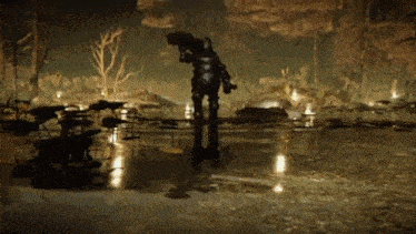 a man in armor is holding a gun in a dark forest