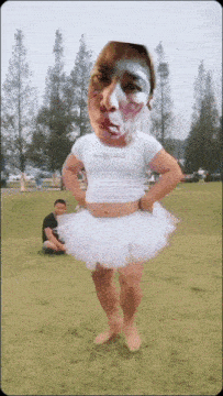 a person in a white tutu with a face painted on their face