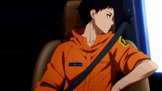 a man wearing an orange shirt with the word kyo on it