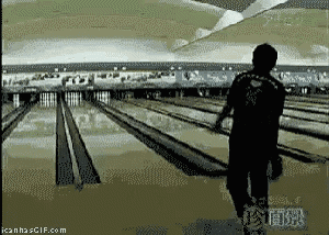 a man is walking down a bowling alley with the website icanha.gif.com visible in the corner
