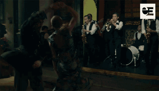 a blurred image of a band with the letters ea on the bottom right