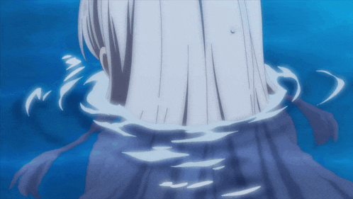 a person 's torso is visible in the water with a blue background
