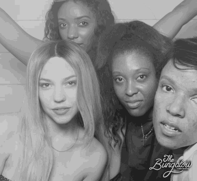 a black and white photo of a group of women taken by the bungalow photography studio