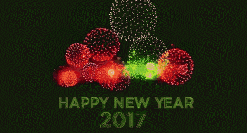 a happy new year greeting card with fireworks displayed in the background