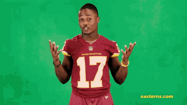 a man wearing a washington redskins jersey with the number 17