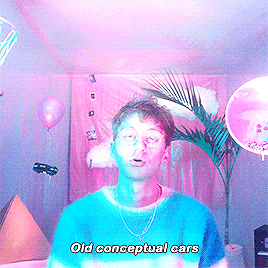a man in a blue shirt with the words old conceptual cars written on it