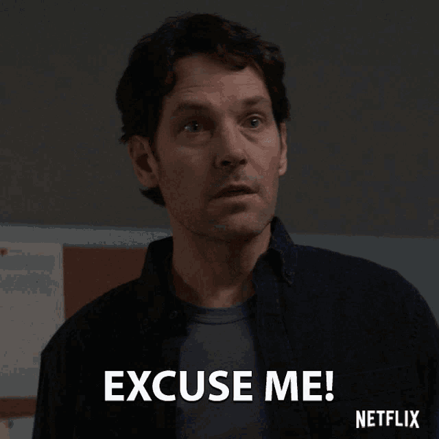 a man in a black shirt says " excuse me "