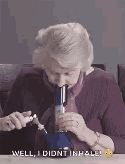 an elderly woman is smoking a bong and says well i didn t inhale