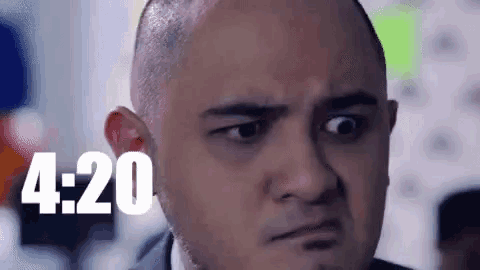 a close up of a man 's face with the words `` 4:20 '' written in the background .