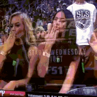 a blurry picture of a sls shirt being worn by a woman