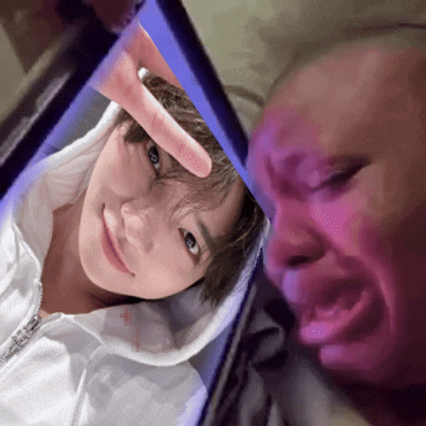 a person taking a picture of another person with their finger
