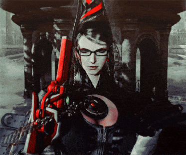 a woman with glasses is holding a red and black object
