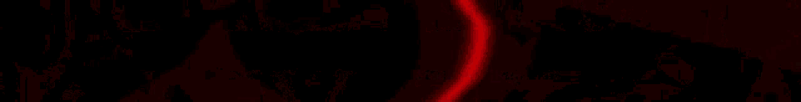a blurred image of a chain with a red background