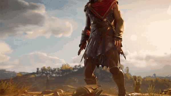 a man in a red cape stands in a field with a helmet on the ground