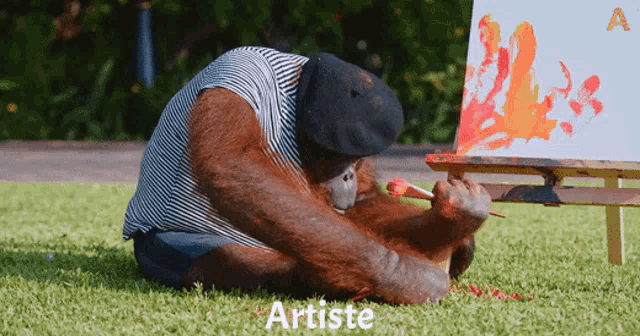 a monkey is sitting on the grass painting on a canvas with the word artiste above it