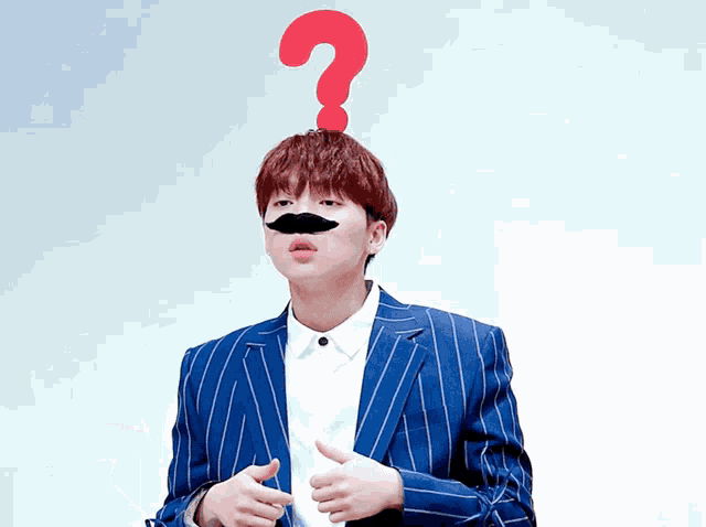 a man in a blue suit has a red question mark on his head