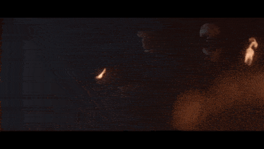 a man in a mask is holding a torch that is on fire
