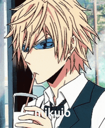 a man in a suit and tie drinking milk through a straw with the name mikujo on the bottom