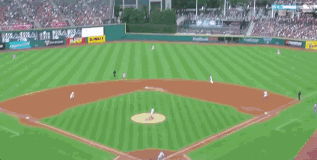 a baseball game is being played in a stadium with a keybank banner