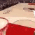 a close up of a red carpet on a table with a blurred background .