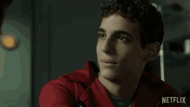 a man in a red jacket says la puta ostia in spanish