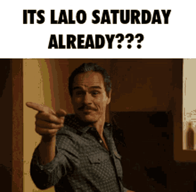 a man with a mustache is pointing at the camera and says " its lalo saturday already " .