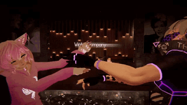a woman in a pink sweater is giving a high five to a man in a black shirt