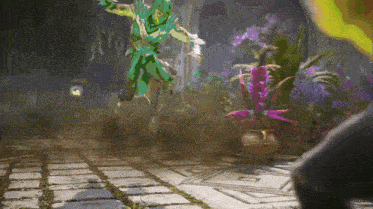 a person in a green costume is jumping in the air with flowers in the background