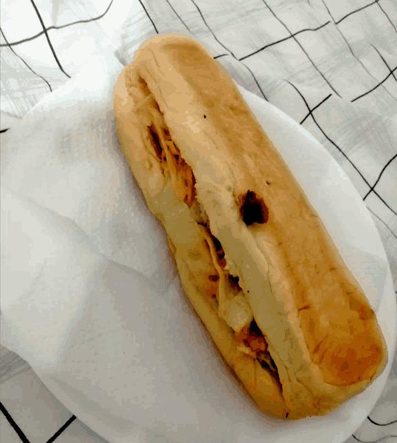 a sandwich with a hole in it is on a plate