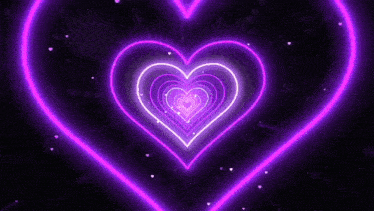 a bunch of neon hearts are glowing in the dark