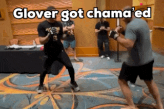 two men are boxing in a room with the caption glover got chama ed