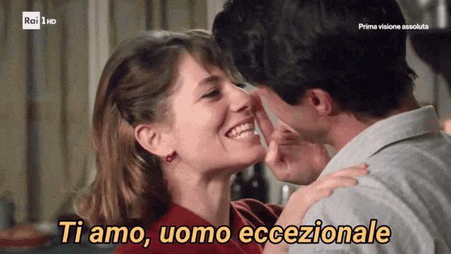 a man kissing a woman with the words ti amo uomo eccezionale below them