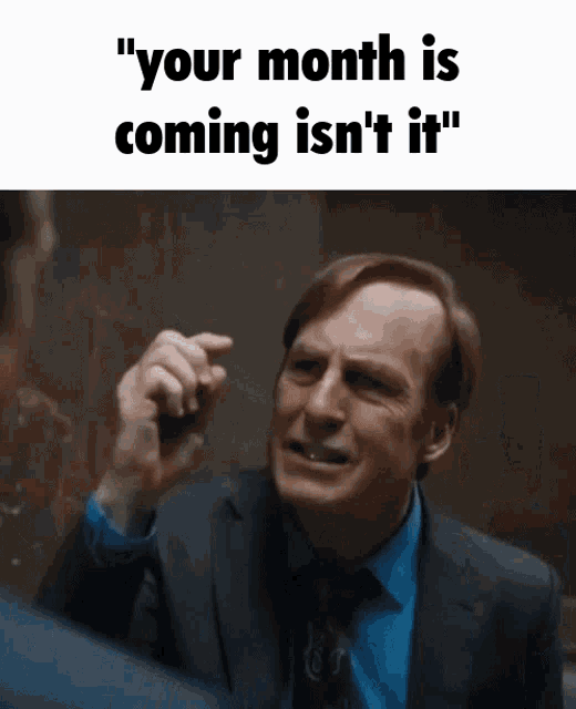 a man in a suit and tie says " your month is coming is n't it "