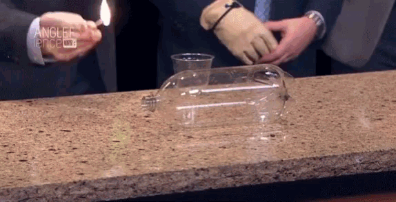 a man is holding a lighter over a plastic container that says angler fence tv