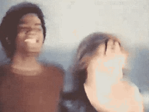 a pixelated image of a man and a woman looking at each other