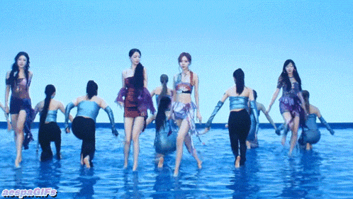 a group of women are dancing in the water and the watermark says naeyeongifs on the bottom