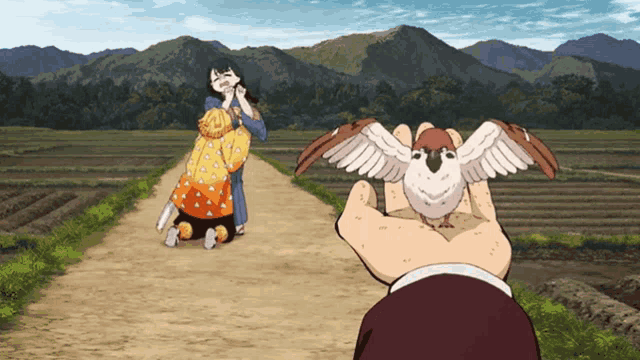 a man is holding a small bird in his hand in front of a woman