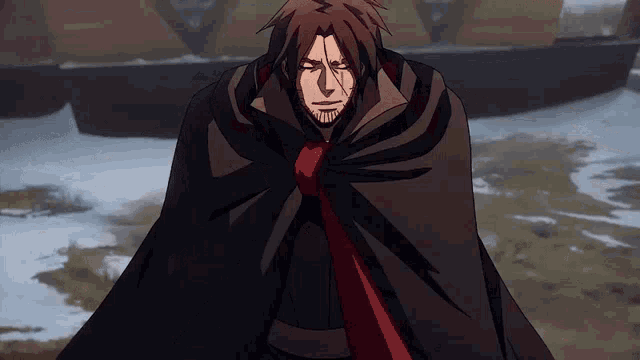 a man with a beard is wearing a black cape and a red tie