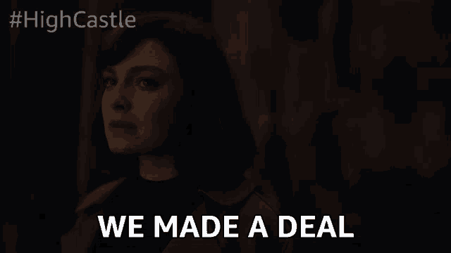a woman says " we made a deal " in front of a dark background